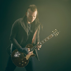 The guitarist plays solo.