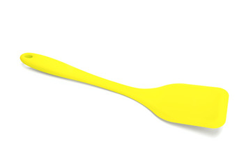 Bright yellow silicone paddle for kitchen