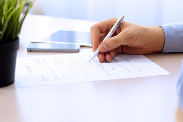 Businessman is signing a contract, business contract details