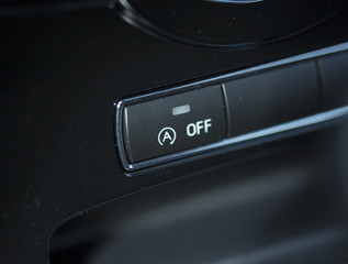 Automatic start and stop function button. The button is from a new modern car.