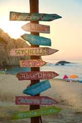 Direction signpost with distance to many different cities © Creaturart