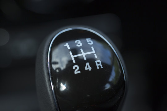 Manual gear stick of a new and modern car.