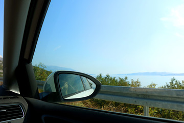 Taking a photo through a car window during a roadtrip.