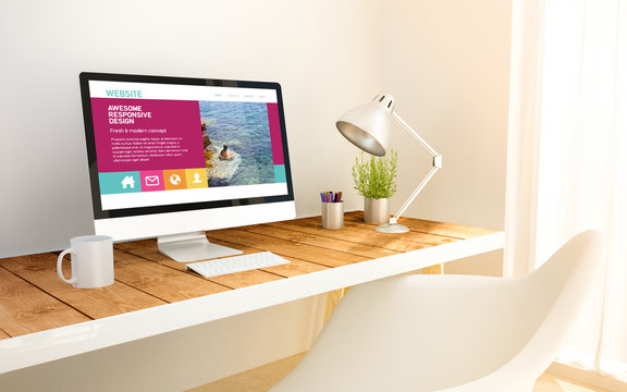 minimalist workplace with fresh design website on computer