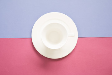 Blank white coffee cup and saucer