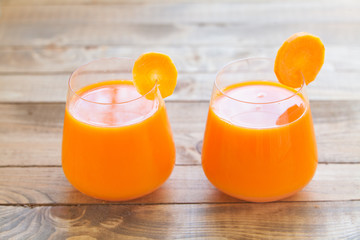 Carrot juice in glass on  table