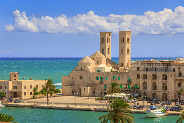 View of  Molfetta old town: the harbor and the Old Cathedral of St. Conrad (Duomo Vecchio of San Corrado).ITALY(Apulia).Old Cathedral of Molfetta in Romanesque style.