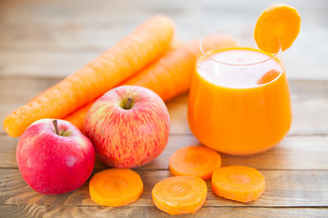 Carrot juice in glass on  table