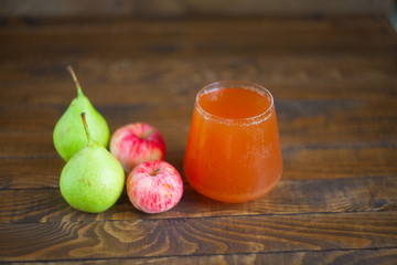 juice of pears and apples  in glass on  table