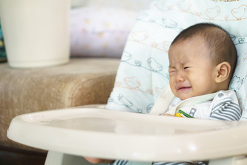 Asian baby feeding time