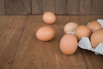 Fresh rural eggs on a wooden board