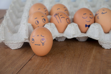 Sadness on wedding Eggs face action on egg-shell in brown paper