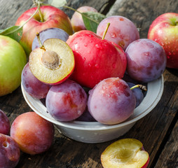 Ripe plums and apples