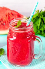 Fresh watermelon Smoothie juice on blue vintage rustic wood background