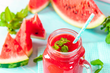 Fresh watermelon Smoothie juice on blue vintage rustic wood background