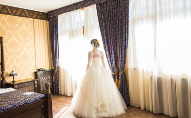 beautiful young bride standing and waiting