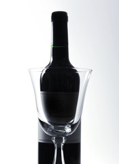 Red wine and wine glass, studio isolated