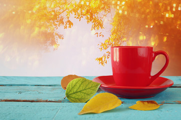 Autumn background with dry leaves and cup of coffee