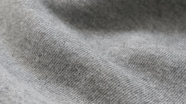 Grey training shirt or pants fine fabric texture close-up 4K 2160p 30fps UltraHD tilting footage - Cotton and polyester sweater pattern of cloth slow tilt 4K 3840X2160 UHD video 