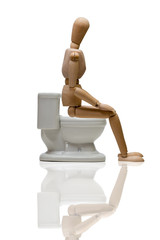 トイレに座るデッサン人形