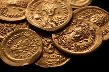 Ancient gold Byzantine coins with emperor portraits