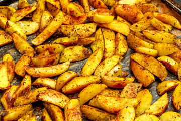 Baked potatoes with spices and salt baking sheet