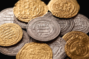 Pile of ancient golden and silver islamic coins