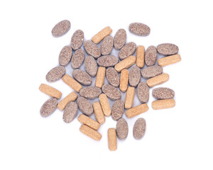 Natural vitamin supplement pills on white background