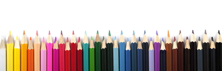 Colored pencils on white background. Panorama.