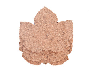 Maple leaf shape cork pads separated on white background