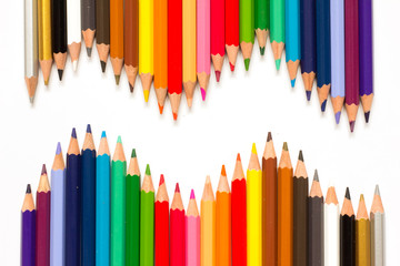 Row of color pencil on white background