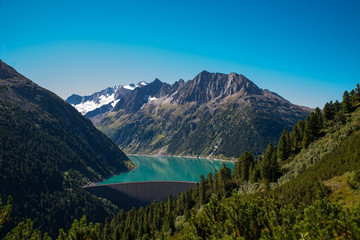 Naklejka na ściany i meble Lake Schlegeis dam Zillertal, Austria / Beautiful water reservoir for hydropower in the Tyrolean Alps