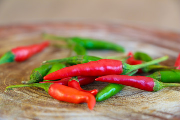Green chili and red chili isolated.