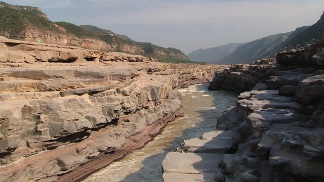 View to the Yellow river (Huang He) next to the Hukou waterfall in Yichuan, China. Hukou is the largest waterfall at Yellow river and the second largest in China.