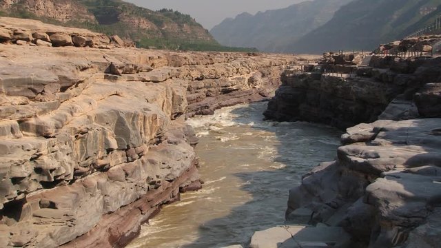 View to the Yellow river (Huang He) next to the Hukou waterfall in Yichuan, China. Hukou is the largest waterfall at Yellow river and the second largest in China.