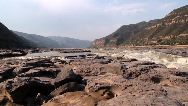 View to the Hukou waterfall at Yellow river (Huang He) in Yichuan, China. Hukou is the largest waterfall at Yellow river and the second largest in China.