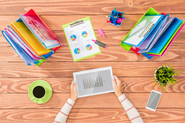 Overhead shot of woman working on tablet in office