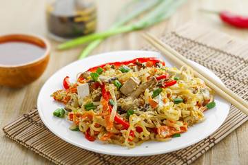 Traditional oriental food made of rice noodles, vegetables, shiitake and tofu. Asian meal.