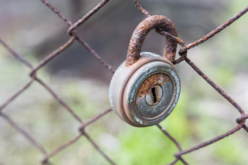 Padlock on the fence.