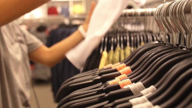 Woman Shopping in Clothing Store