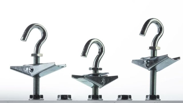 row of screw with caps wrenching on white background