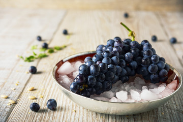 black grapes on the crushed ice, selective focus