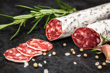Salami on dark background