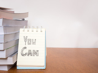 Inspirational motivational quote with many book on the wooden table, Education concept.