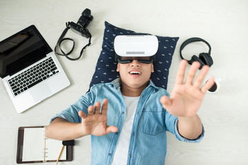 Top view of Man wearing virtual reality goggles