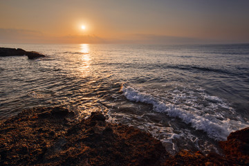 Sunset sky above the sea shore. Beautiful landscape.