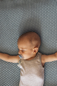 Adorable baby sleeping in cot