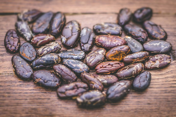 cocoa beans on wooden background