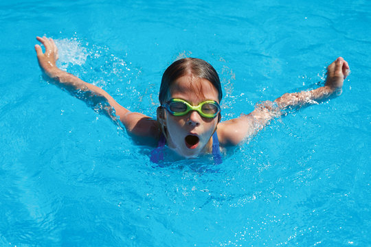 Child swims butterfly style