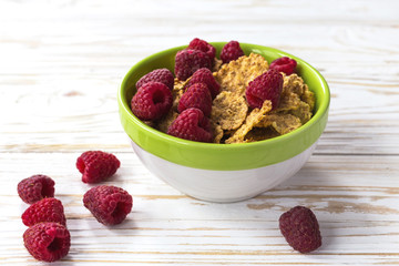 Healthy corn flakes breakfast on the white wooden table